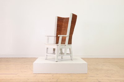 Lot 89 - A pine, straw and seagrass armchair