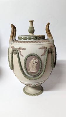 Lot 73 - A pair of Wedgwood jasperware urns and covers