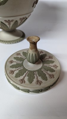 Lot 73 - A pair of Wedgwood jasperware urns and covers