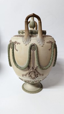 Lot 73 - A pair of Wedgwood jasperware urns and covers