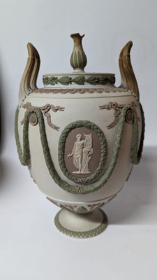 Lot 73 - A pair of Wedgwood jasperware urns and covers
