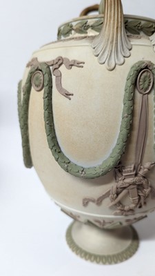 Lot 73 - A pair of Wedgwood jasperware urns and covers