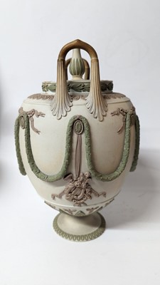 Lot 73 - A pair of Wedgwood jasperware urns and covers