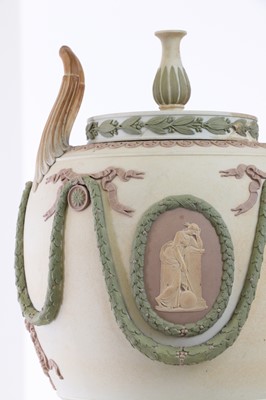 Lot 73 - A pair of Wedgwood jasperware urns and covers