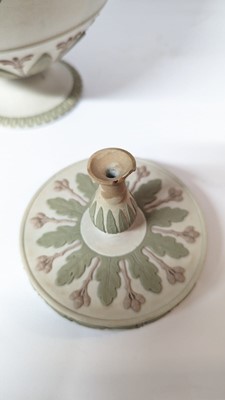 Lot 73 - A pair of Wedgwood jasperware urns and covers