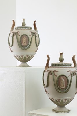 Lot 73 - A pair of Wedgwood jasperware urns and covers