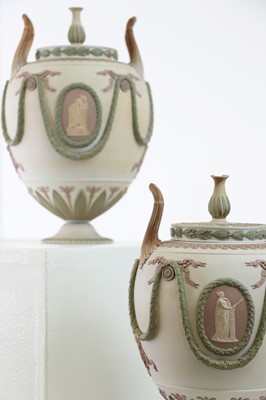 Lot 73 - A pair of Wedgwood jasperware urns and covers