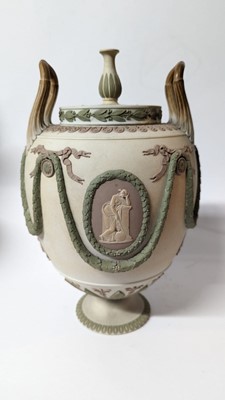 Lot 73 - A pair of Wedgwood jasperware urns and covers