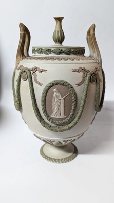 Lot 73 - A pair of Wedgwood jasperware urns and covers