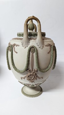 Lot 73 - A pair of Wedgwood jasperware urns and covers