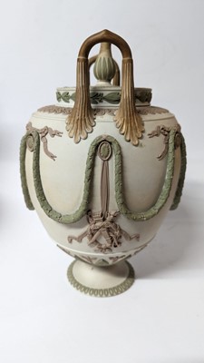 Lot 73 - A pair of Wedgwood jasperware urns and covers