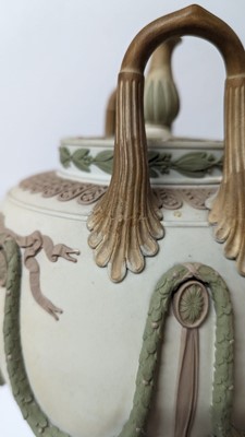 Lot 73 - A pair of Wedgwood jasperware urns and covers
