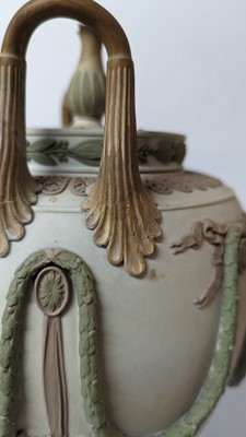 Lot 73 - A pair of Wedgwood jasperware urns and covers