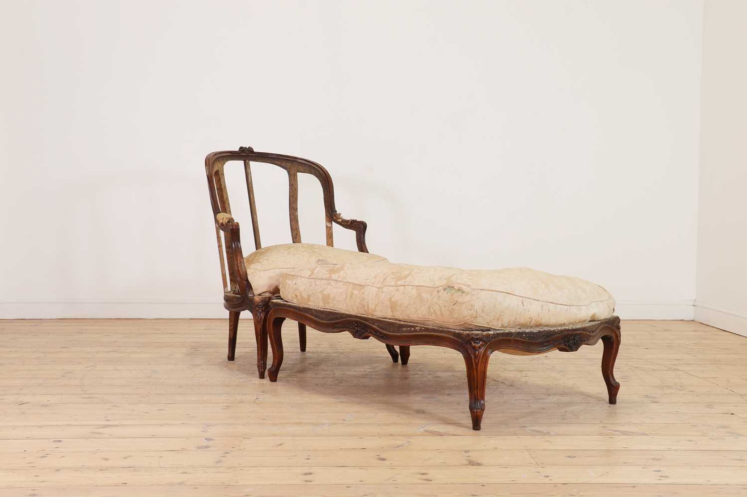Lot 72 - A Louis XV carved walnut duchesse brisée