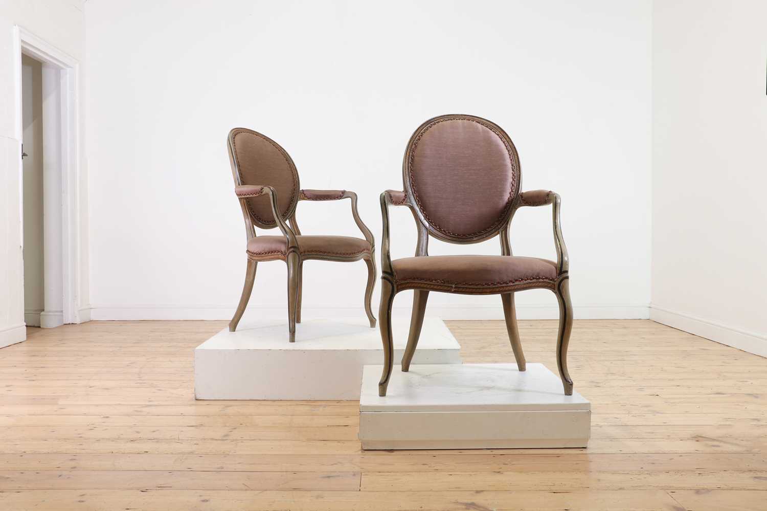 Lot 45 - A pair of George III-style painted open armchairs