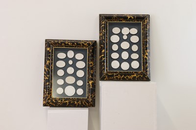Lot 414 - A pair of plaster intaglio displays