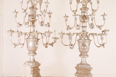 Lot 480 - A pair of very large silvered-pine pricket torchères