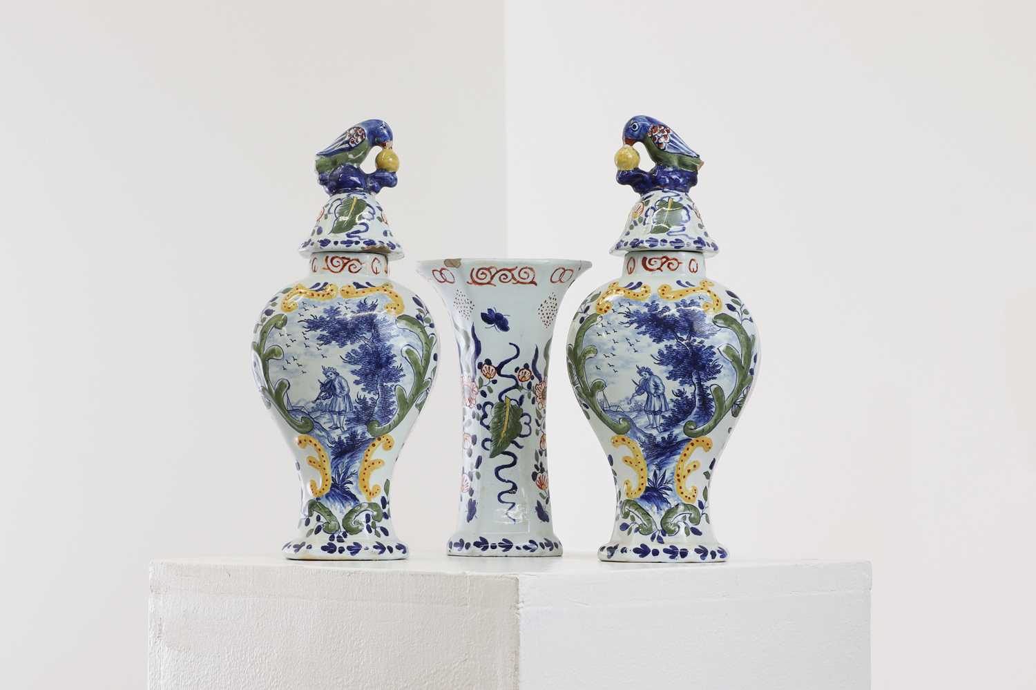 Lot 286 - A delft pottery polychrome part garniture