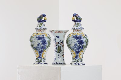 Lot 286 - A delft pottery polychrome part garniture