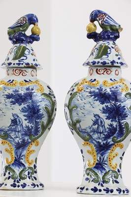 Lot 286 - A delft pottery polychrome part garniture