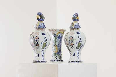 Lot 286 - A delft pottery polychrome part garniture