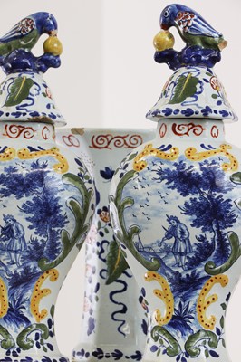 Lot 286 - A delft pottery polychrome part garniture
