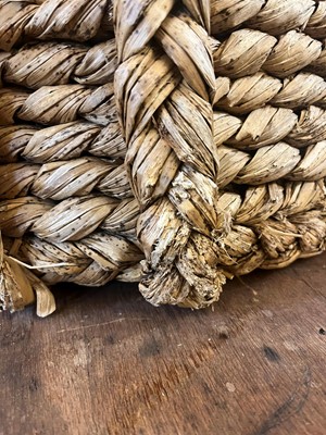 Lot 385 - A woven rush log basket