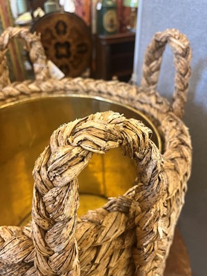 Lot 385 - A woven rush log basket