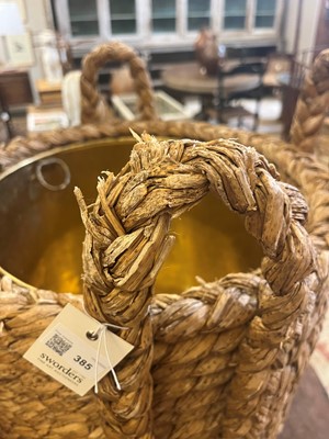 Lot 385 - A woven rush log basket