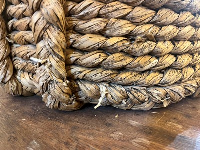 Lot 385 - A woven rush log basket