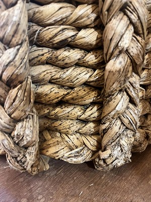 Lot 385 - A woven rush log basket