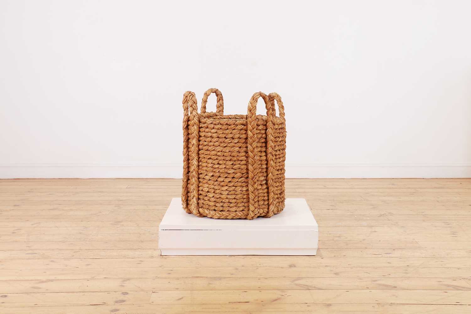 Lot 385 - A woven rush log basket