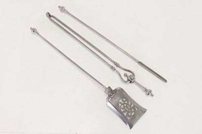Lot 384 - A set of polished steel fire tools
