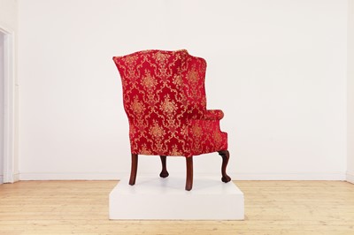 Lot 170 - A George I-style wingback armchair