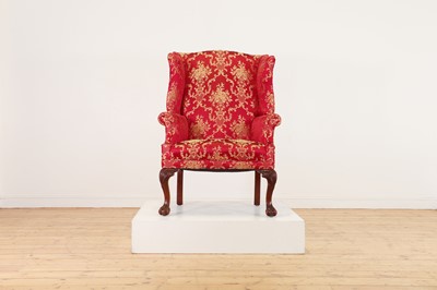 Lot 170 - A George I-style wingback armchair