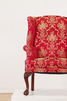 Lot 170 - A George I-style wingback armchair