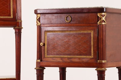 Lot 182 - A pair of Directoire-style mahogany tables de nuit