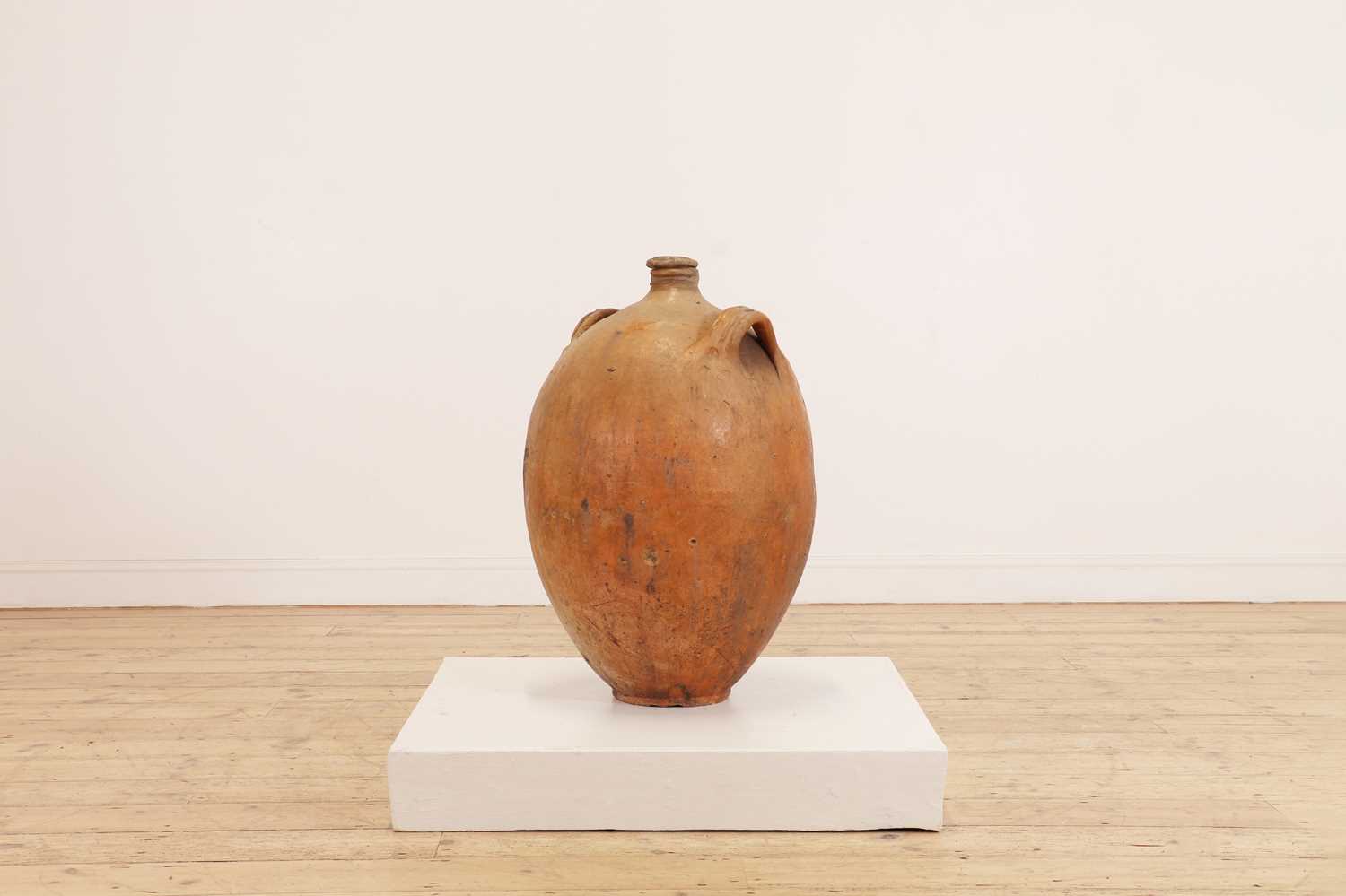 Lot 370 - A terracotta oil pot