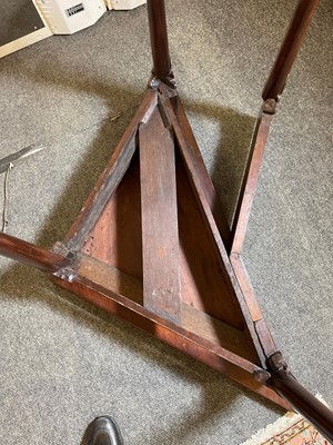 Lot 488 - A mahogany triangular tea table