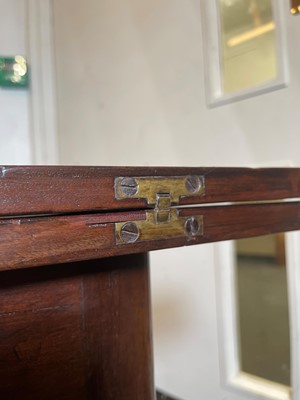 Lot 488 - A mahogany triangular tea table