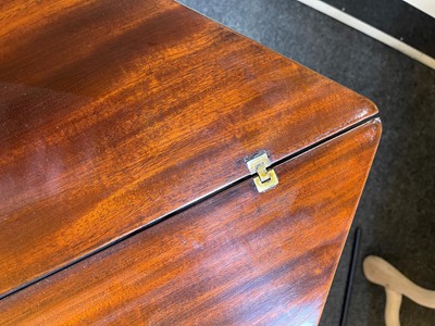 Lot 488 - A mahogany triangular tea table