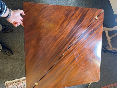 Lot 488 - A mahogany triangular tea table