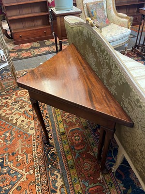 Lot 488 - A mahogany triangular tea table