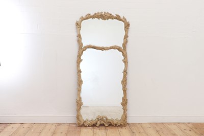 Lot 83 - A carved wooden mirror in the Black Forest style