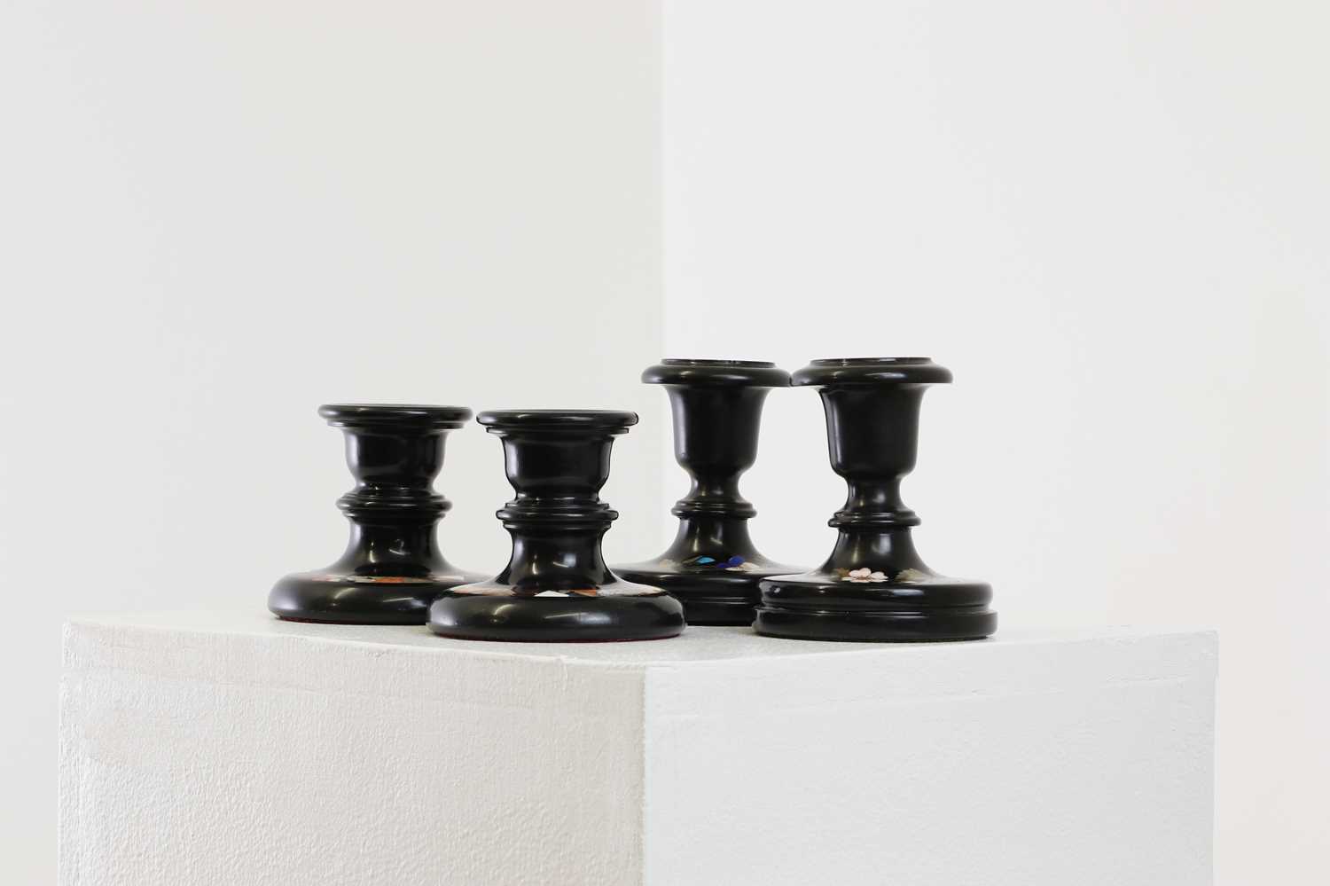 Lot 250 - A pair of Ashford black marble candlesticks