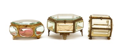 Lot 306 - A group of three glass jewellery caskets