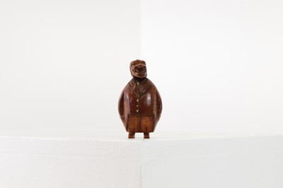 Lot 162 - A coquilla nut figural snuffbox