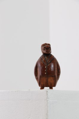 Lot 162 - A coquilla nut figural snuffbox