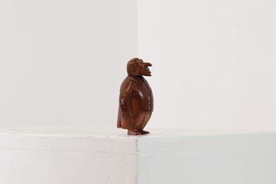 Lot 162 - A coquilla nut figural snuffbox