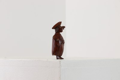 Lot 163 - A coquilla nut figural snuff box